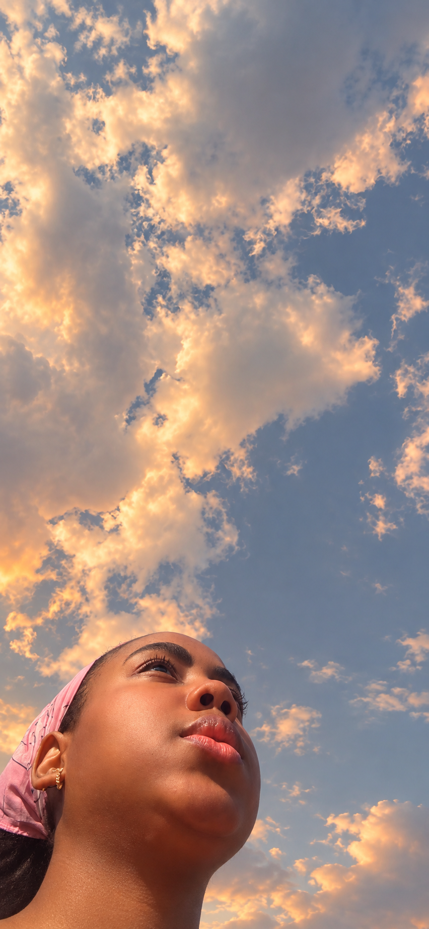 Melo beneath a softly colored sky